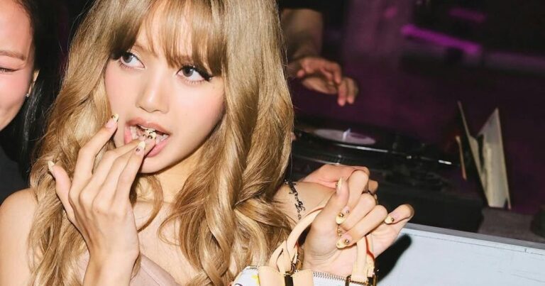 Lisa takes her labubus (and a metallic mini dress) out